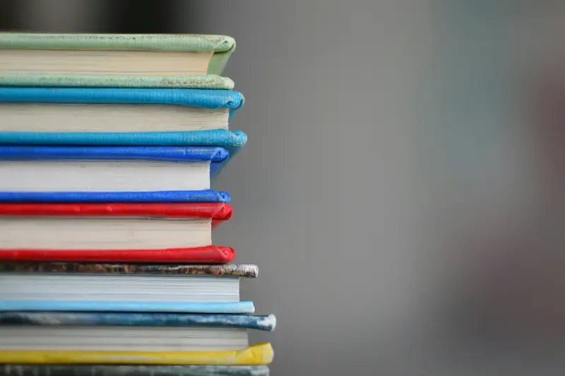 The corners of brightly colored books.