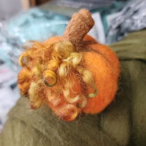 A picture of a felted pumpkin for a class being taught at Sunshine Weaving and Fiber Arts.