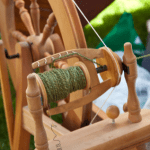 A picture of a a spinning wheel to help describe the beginning spinning class at Sunshine Weaving and Fiber Arts.